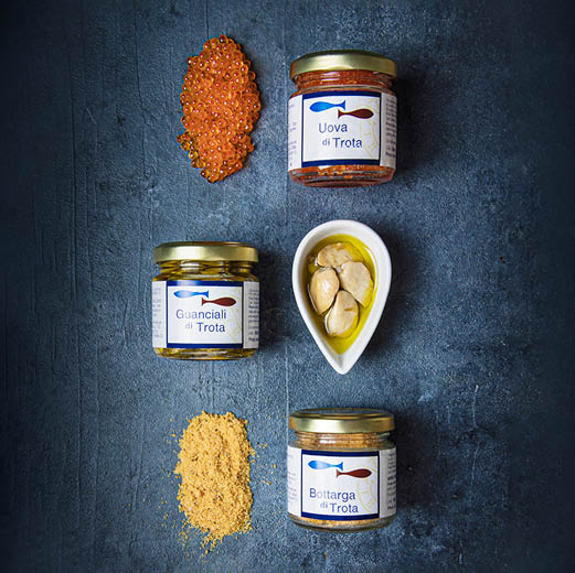 Three jars of spices are lined up on a table, with one jar containing a yellow substance. AI generated content